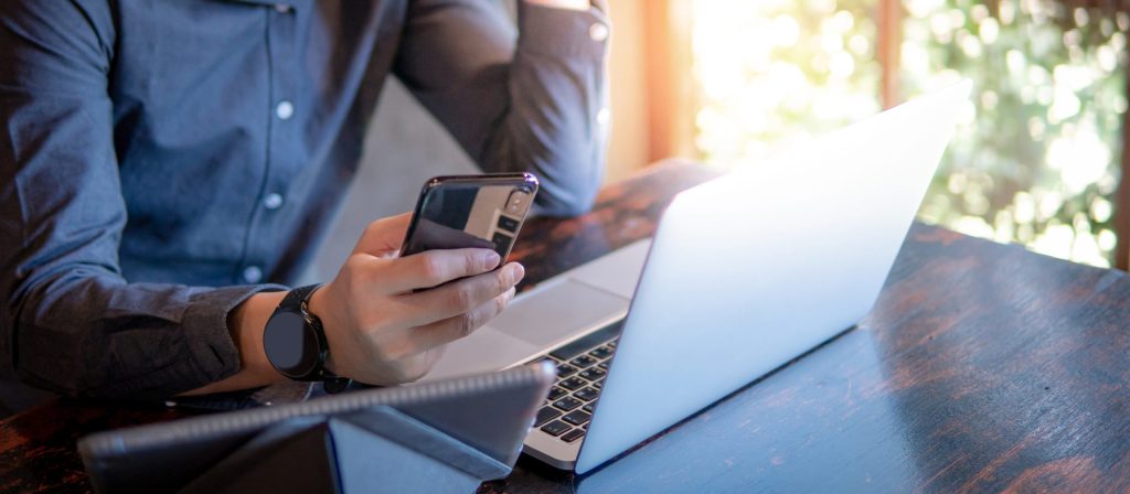 Male hand holding smartphone