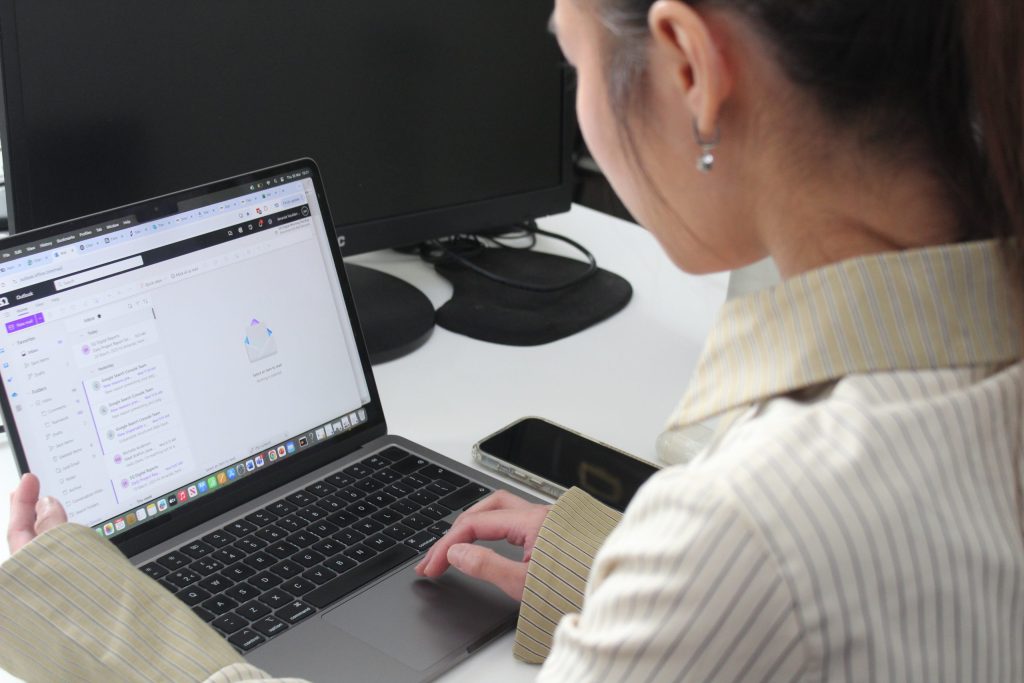 woman typing in a laptop