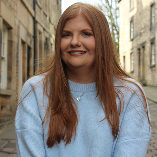 woman smiling in a business picture