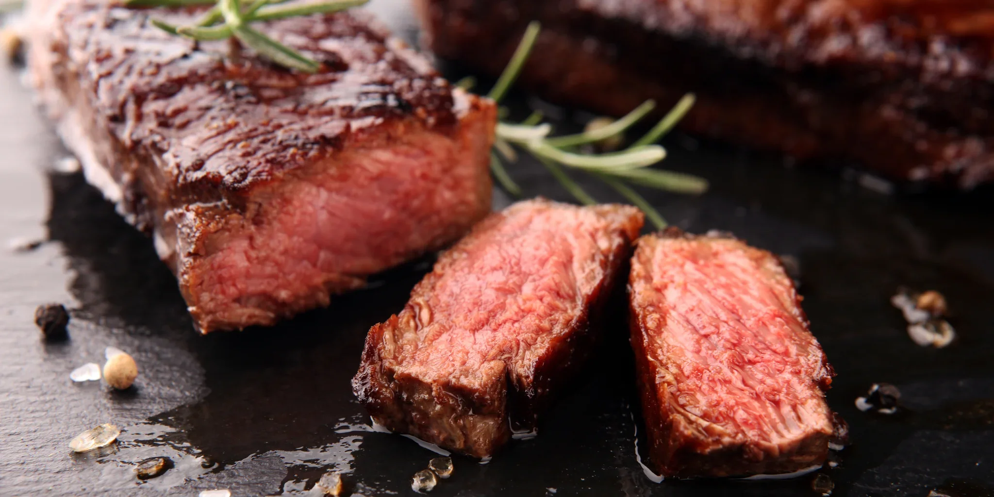 steak in a plate, cuted with herbs