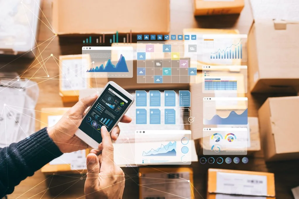man working on his phone and reflect of the screen showing graphs