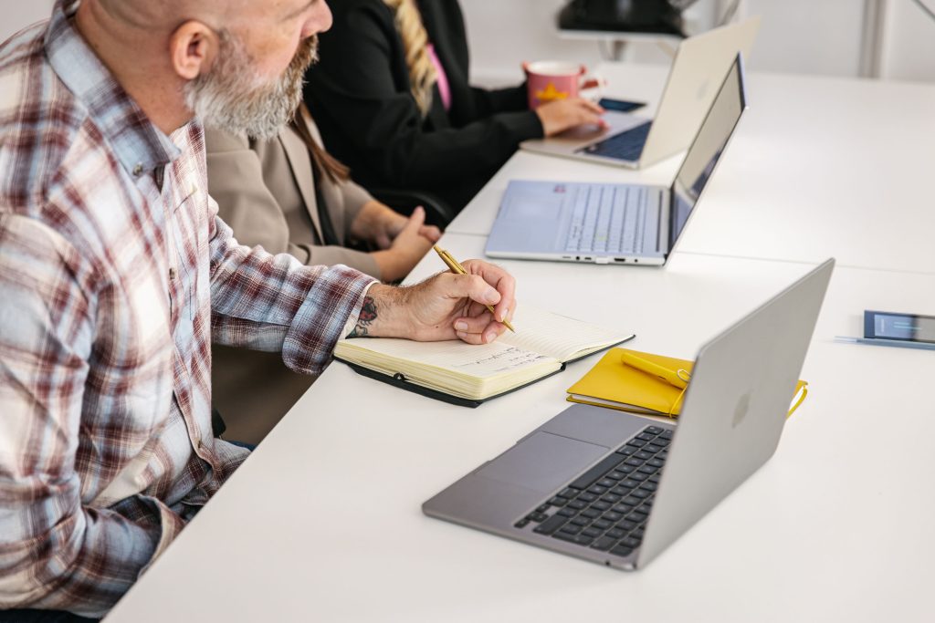 man taking notes in an office