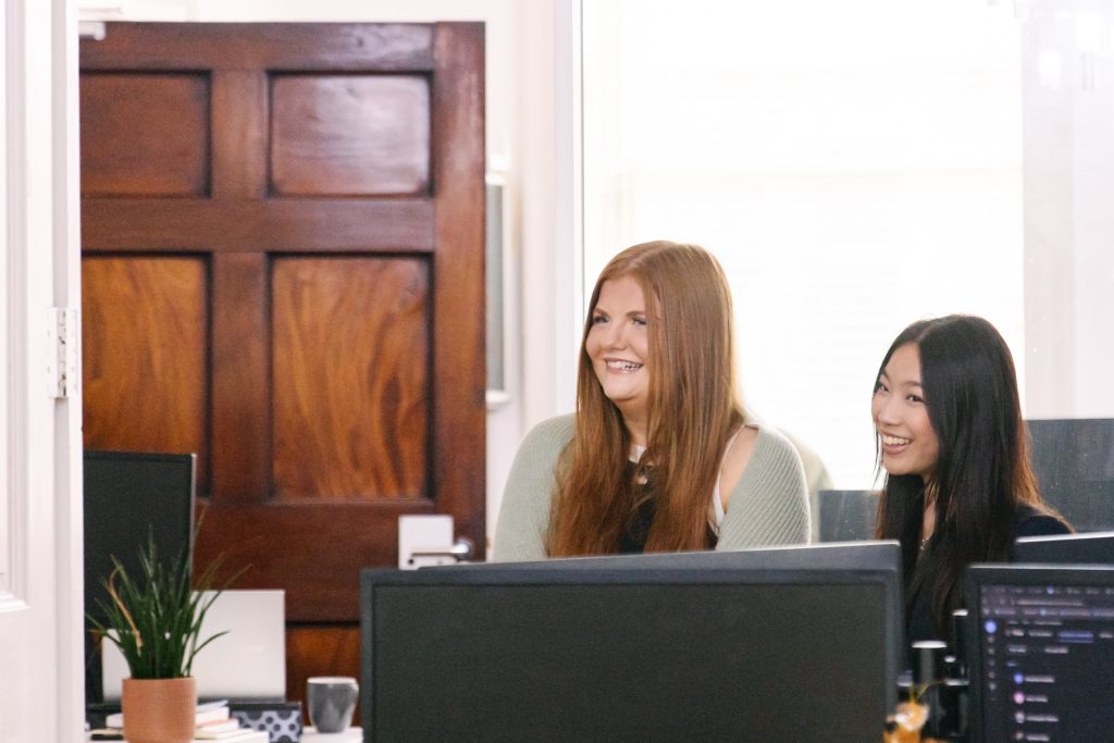 two woman from SQ Digital smiling