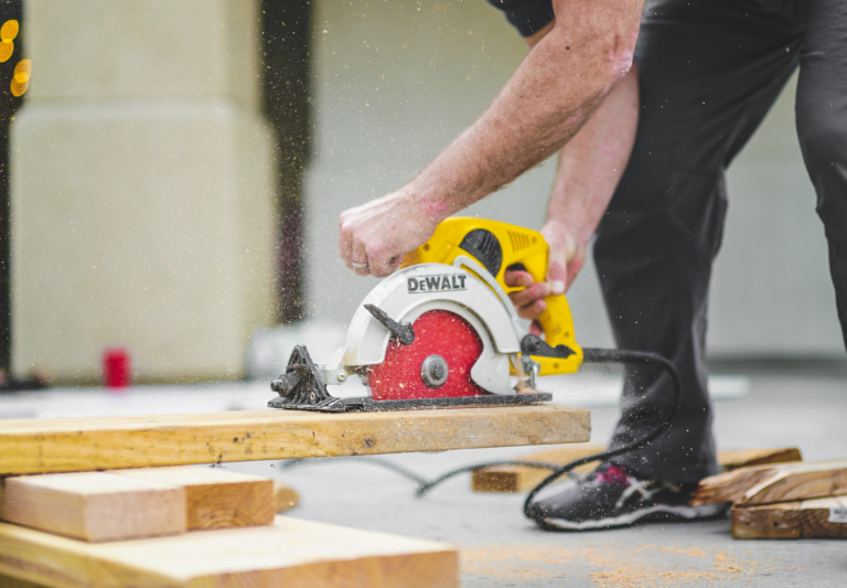 construction man cutting wood